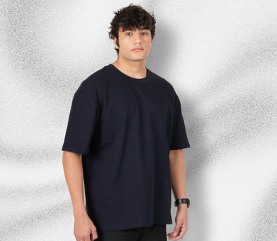 Model wearing Rabitual navy blue oversized t-shirt – trendy streetwear outfit inspiration.