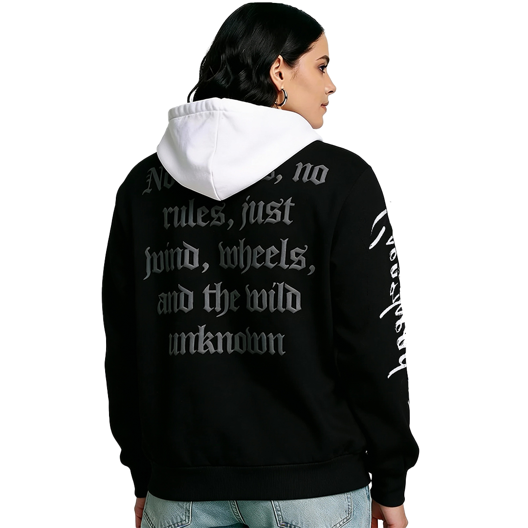 Person wearing a black hoodie with white text on the back, standing against a white background